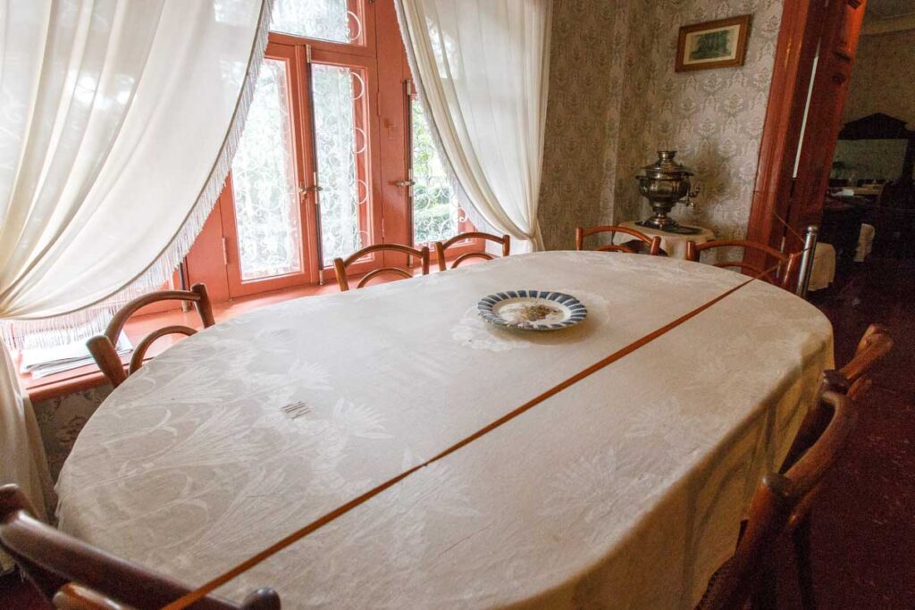 The extending dining table nicknamed “the centipede” and the Viennese chairs, specially bought for the Yalta house
